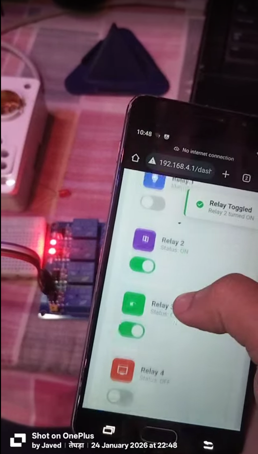Figure 4: Real-time relay control through the embedded web dashboard at 192.168.4.1/dash, showing instant physical relay actuation and active-LOW channel LEDs.
